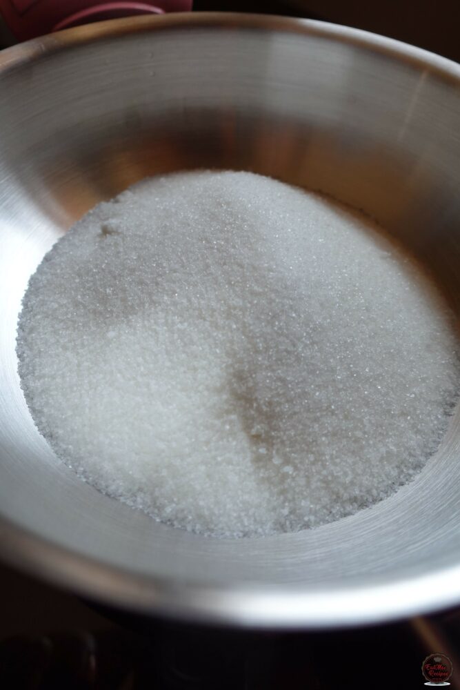 After a day or two, once you are done draining the Banana Puri's, start making the syrup by adding the sugar to a pot.