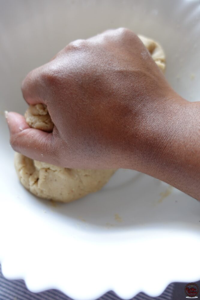 Use your hands to bring the dough together.