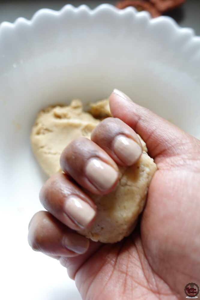 Clench the dough in you palm & the roll into a log using both hands. 