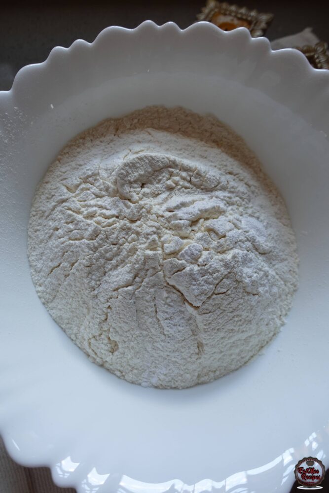 Sift the flour into a mixing bowl & add in the baking powder & salt.