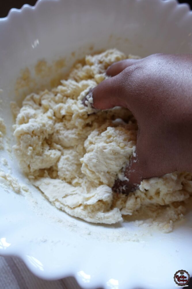 Use your hands to bring the dough together.