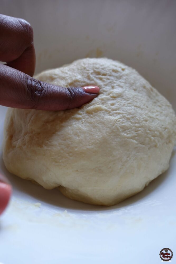 There is no need to add more flour or ghee, the dough should knead well & come together.