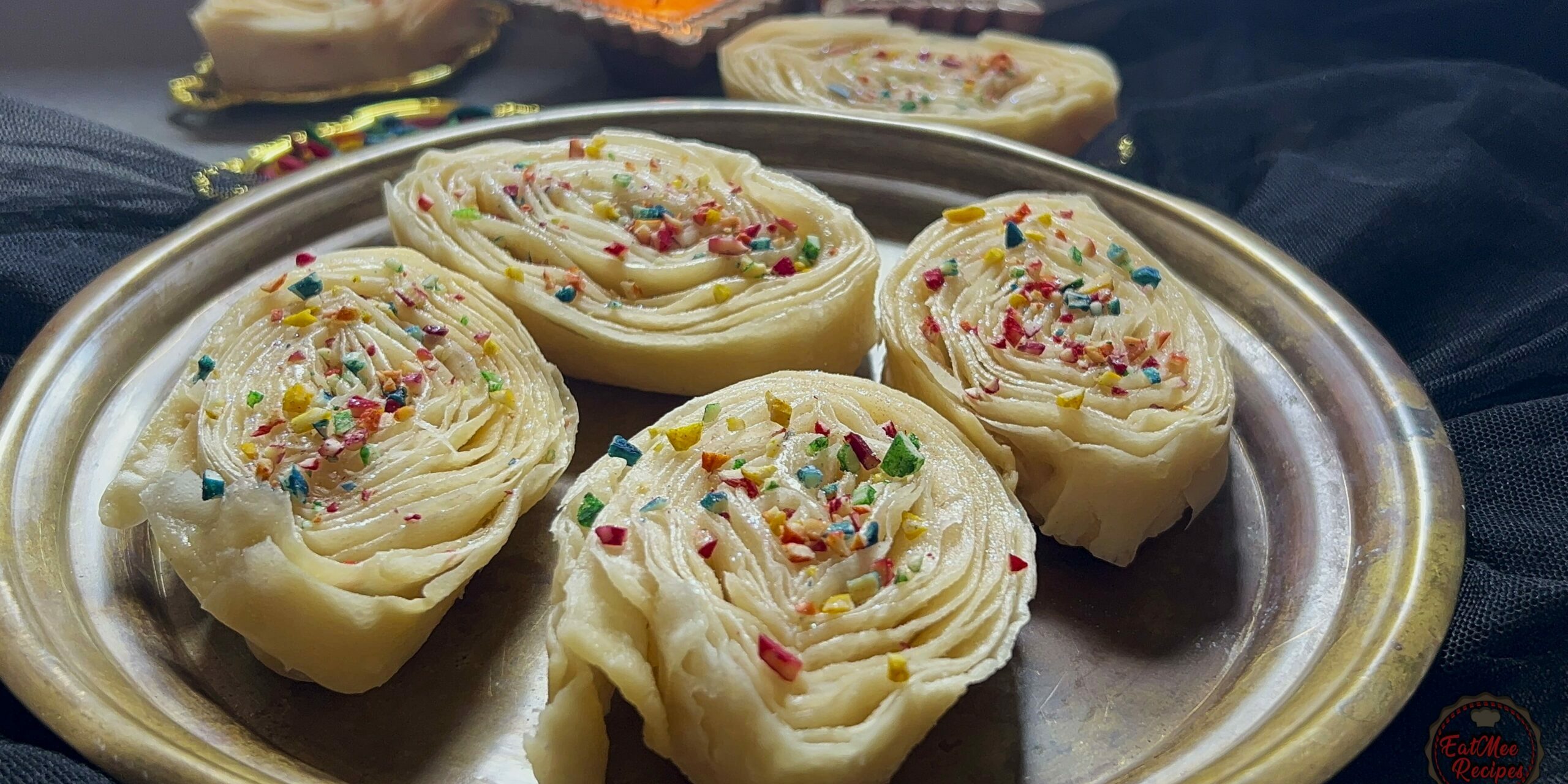 When it comes to traditional Indian sweets & snacks, khaja holds a special place in our hearts. Often referred to as banana puri, this delectable treat offers a unique blend of flavors & textures, making it a beloved delicacy. Let’s delve into the preparation & charm of khaja, & why it deserves a spot in your culinary repertoire.